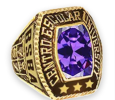 A gold university ring with a large purple gemstone.