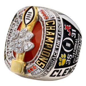A sparkling championship ring with football details and Clemson branding.