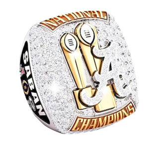 Close-up of a championship ring with gold and diamond details.