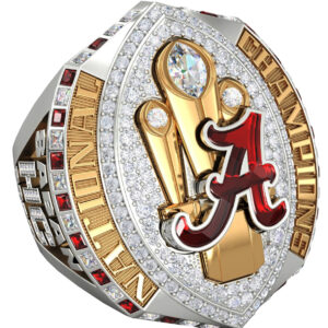 A championship ring with Alabama's logo and multiple gems.