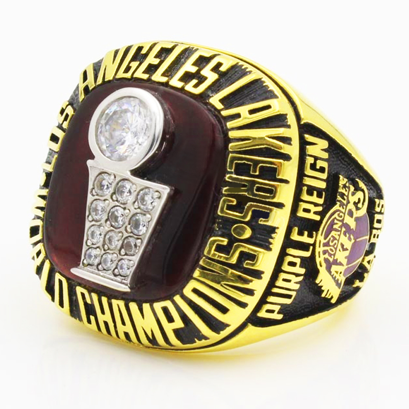 A Los Angeles Lakers championship ring with a gold and purple design.