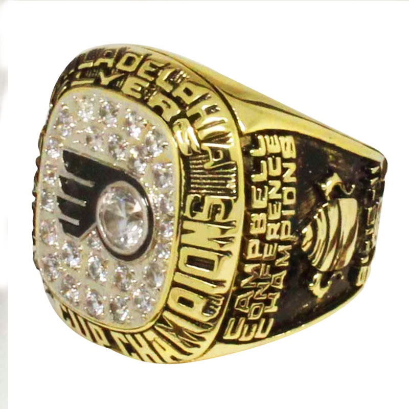 Close-up of a gold Philadelphia Flyers championship ring with diamonds.