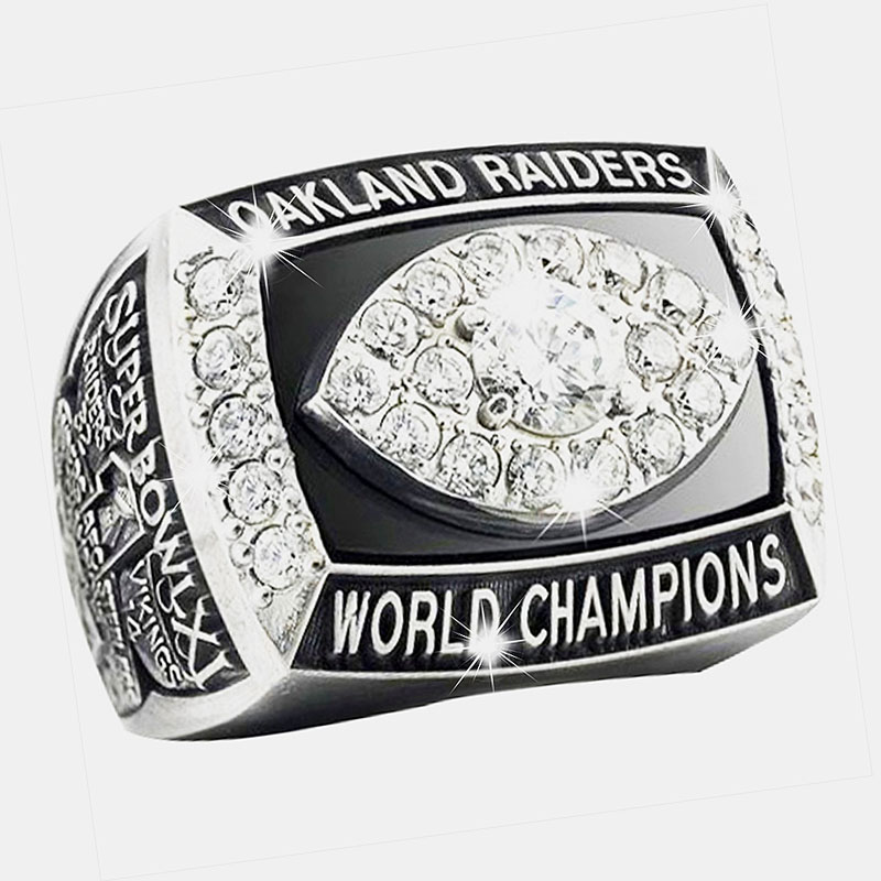 Oakland Raiders' World Champions ring with diamonds and engraved details.