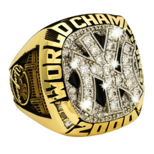 A gold New York Yankees 2000 World Championship ring with diamonds.