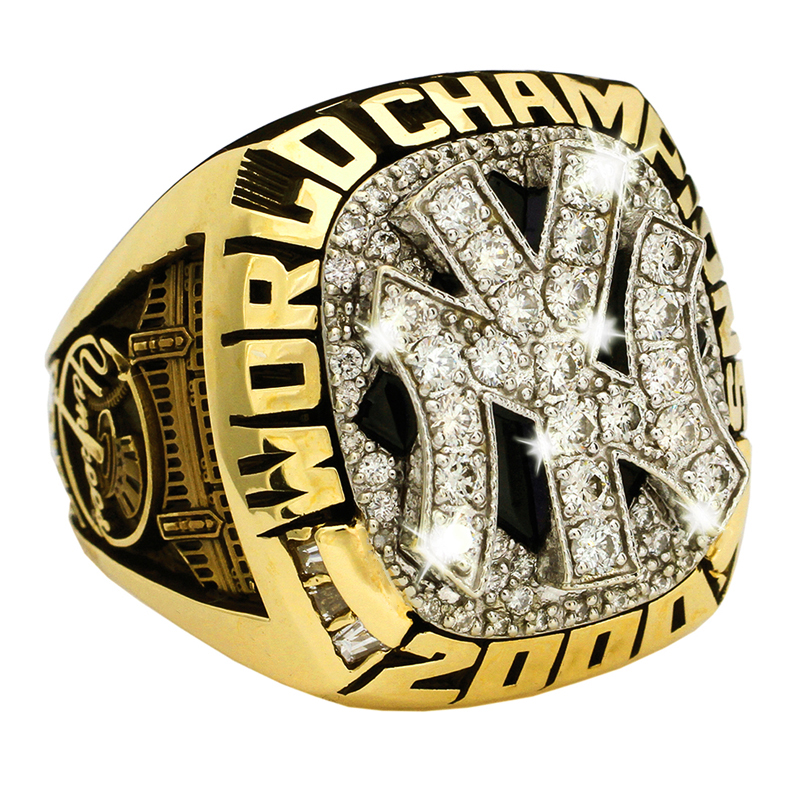 A gold New York Yankees 2000 World Championship ring with diamonds.