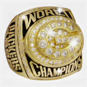 Close-up of a sparkling championship ring with diamonds and engraved text.