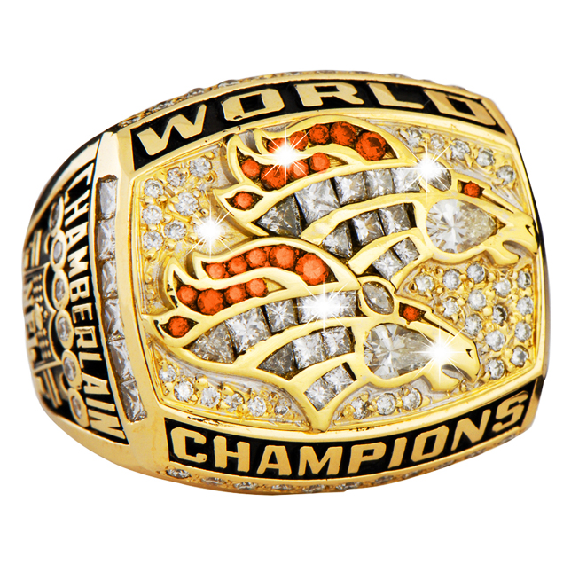 Close-up of a sparkling World Champions ring with intricate design.